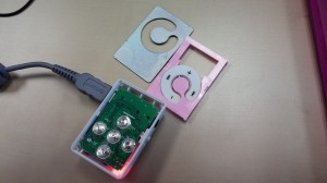 MP3 player with face removed and tactile domes exposed